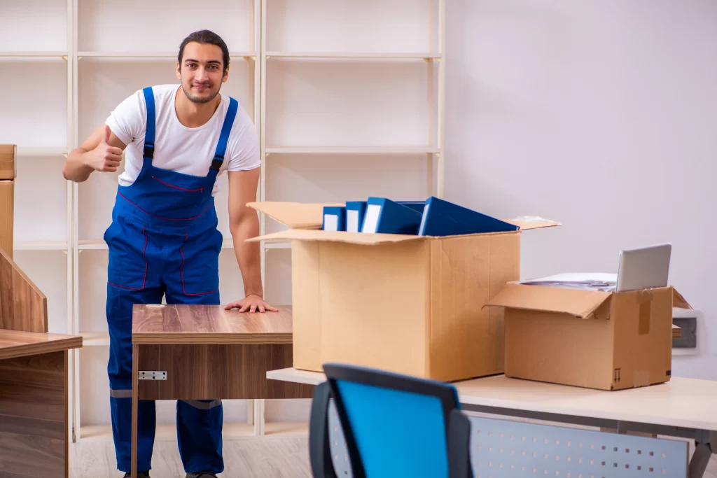 Professional movers packing boxes for a seamless International moving